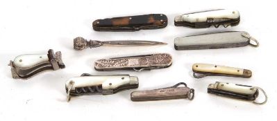 Mixed Lot: A sterling cased multi-tool penknife, a vintage sterling page marker, a small silver