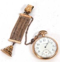 A gold plated Waltham open faced pocket watch with a chain, it has a manually crown wound