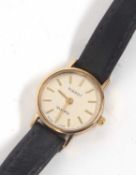 A 9ct gold cased Tissot lady's wristwatch, stamped 375 on the inside of the case back, it has a