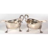 Pair of George V silver sauce boats of typical form having wavey rim border and an acanthus detail