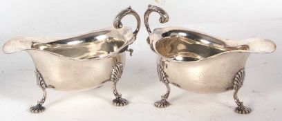 Pair of George V silver sauce boats of typical form having wavey rim border and an acanthus detail