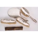 Mixed Lot: Silver backed dressing table wares to include mirror, two clothes brushes, hair brush and