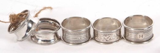 Group of five hallmarked silver serviette rings, various dates and makers, g/w 52gms