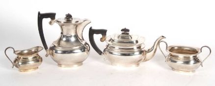 George VI silver four piece tea service comprising a coffee pot, teapot, sugar bowl and cream jug of