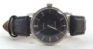 A gent's Omega Seamaster, the watch has a manually crown would calibre 601 movement, it has a black