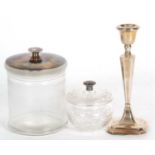 George V silver candlestick of tapering octagonal form, loaded base and hallmarked for Birmingham