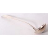 A George IV silver fiddle pattern soup ladle engraved and dated with initials, having an oval bowl
