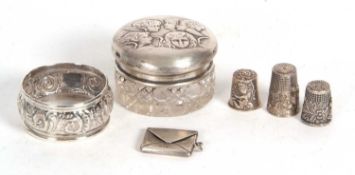 Mixed Lot: A George V silver stamp case in the form of an envelope, silver serviette ring, a glass