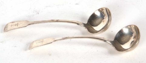 A pair of Irish silver fiddle pattern ladles, each engraved with a castle turret, having oval shaped