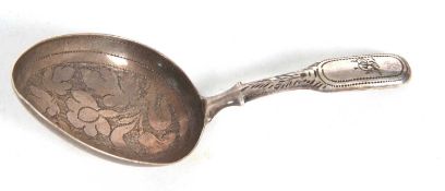 A George IV silver caddy spoon, the egg shaped bowl engraved and chased with leaves, the handle