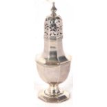 An Edwardian silver caster of octagonal form with pull off pierced lid, supported on a spreading