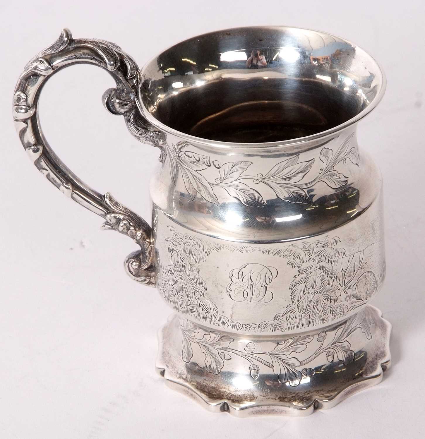 A Victorian silver small mug of cylindrical form, engraved and chased with birds, deer and foliate - Image 2 of 5