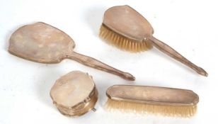 Five pieces of dressing table wares to include a hand mirror, ring box, clothes and hair brush, each