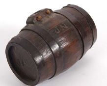 Vintage small oak wooden spirit barrel having oak staves and iron bands with burnt in initials J.