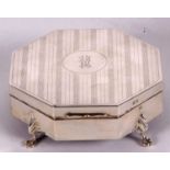 A George VI silver jewellery or ring box of octagonal form, engine turned decorated hinged lid and