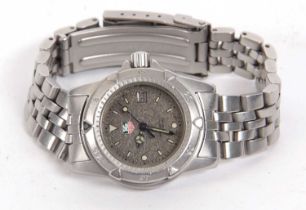 Tag Heuer lady's professional quartz wristwatch, it has a stainless steel case and bracelet, it