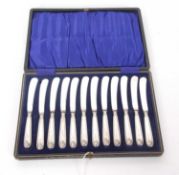 A cased set of twelve George VI silver handled butter knives, Sheffield 1947, makers mark for