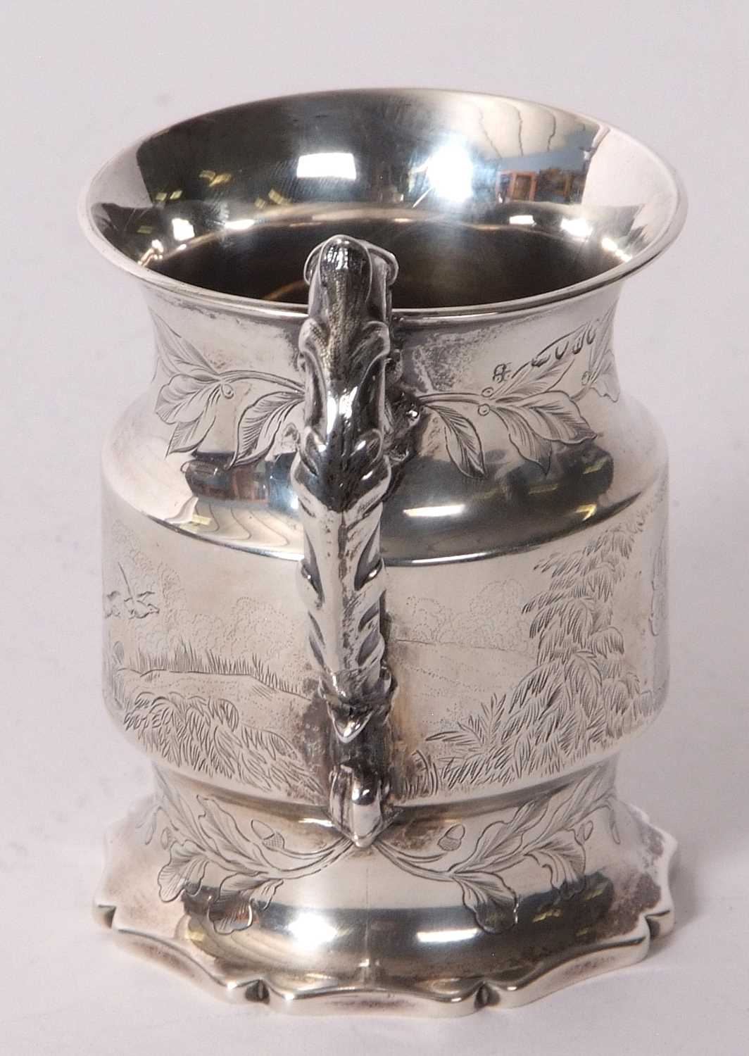 A Victorian silver small mug of cylindrical form, engraved and chased with birds, deer and foliate - Image 4 of 5