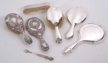 Mixed Lot: Three silver backed dressing table mirrors, two hairbrushes, one clothes brush together