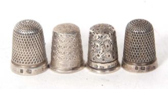 Group of four hallmarked silver thimbles
