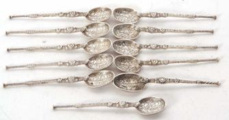 Eleven Hallmarked silver annoiting spoons, ten hallmarked London 1901, makers mark Cornelius