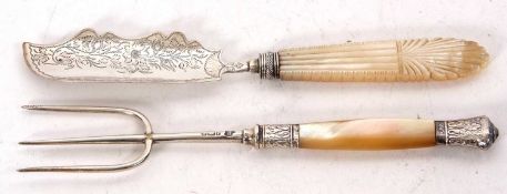 A hallmarked silver three pronged pickle fork, mother of pearl handle with silver ferral and cap,