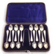 Cased Victorian silver tongs and twelve matching teaspoons with bright cut decoration, hallmarked