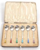 Cased set of six Art Deco silver and enamel teaspoons with multi-coloured coffin shaped enamel