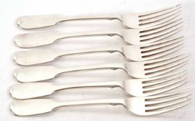 A set of six Victorian silver fiddle pattern table forks, London 1865. makers mark for William