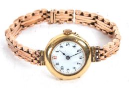 An 18ct gold lady's wristwatch on a yellow metal bracelet, the bracelet is stamped 9ct on the inside