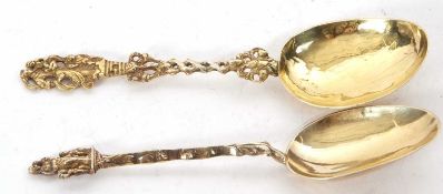 Two 18th Century silver gilt decorative spoons each with figural finials, possibly marked for