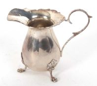 An Elizabeth II silver cream jug in Georgian style, Birmingham 1965, makers mark for Joseph