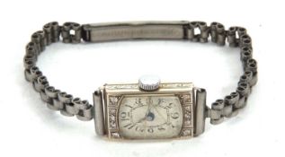 A precious metal cased lady's wristwatch, stamped in the case back 18k plus 0.75, it has a