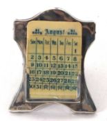An Edwardian silver framed desk calendar, easel backed with celluloid cards (incomplete), hallmarked