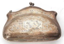 A George V silver purse with scrolling foliate decoration, leather fitted interior, hallmarked