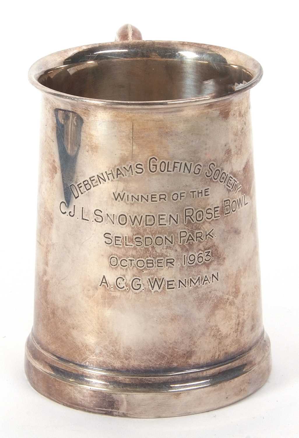 A hallmarked silver pint tankard of slight tapering form having a letter C scroll handle, engraved