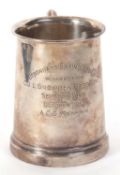 A hallmarked silver pint tankard of slight tapering form having a letter C scroll handle, engraved