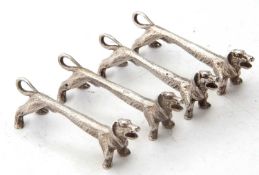 Two pairs of novelty silver knife rests modelled as Dachshund dogs, hallmarked Sheffield 1973,