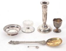Mixed Lot: One silver candlestick hallmarked for Birmingham 1930 (a/f), silver egg cup, Birmingham