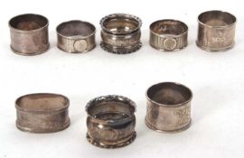 A group of eight hallmarked silver serviette rings, various dates/makers, 154gms