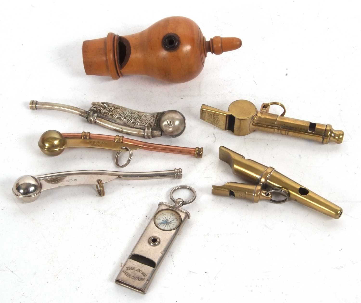 A group of seven various vintage whistles, to include three Bosuns whistles, Acmes Girl Guides