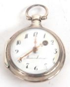 A white metal pocket watch, the pocket watch tests for silver, it has a white enamel dial with a key