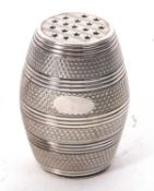 A vintage plated barrel shaped pepper having screw off base, 5cm tall