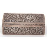 An antique Indian white metal trinket box of rectangular form, the hinged lid and sides with