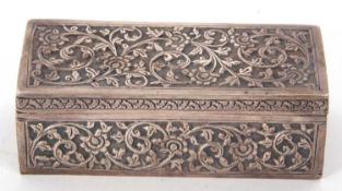 An antique Indian white metal trinket box of rectangular form, the hinged lid and sides with