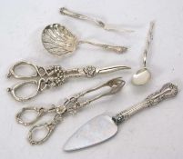 Mixed Lot: A pair of sterling stamped grape shears, sugar tongs and sifter ladle, a 925 marked