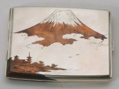 A Japanese sterling cigarette case of rectangular form having a mixed metal front depicting Mount