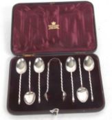A late Victorian cased set of six silver teaspoons and tongs, each with plain bowls with twist stems