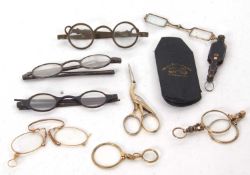 Mixed Lot: A vintage pair of silver folding spectacles, a Victorian quizzer, a 19th Century gilt