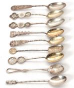 A group of eight Chinese white metal decorative teaspoons marked with character marks together
